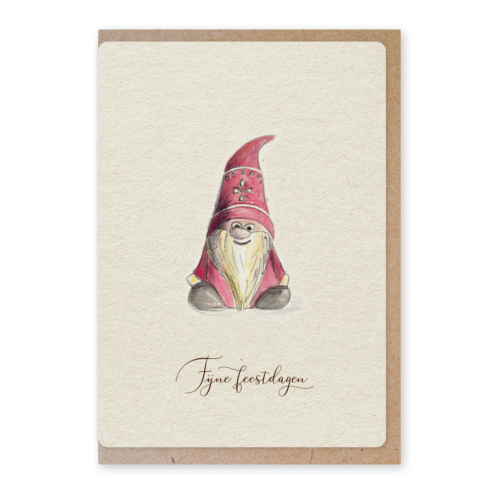 Een mooie duurzame enkele kaart met een tafereel van een tomte / kerstkabouter in aquarel voor een Kerstgroet of een Nieuwjaarswens. De illustraties zijn gemaakt in onze grafische studio. Gedrukt op Paperwise Naturel, boomvrij papier van landbouwrestafval. 