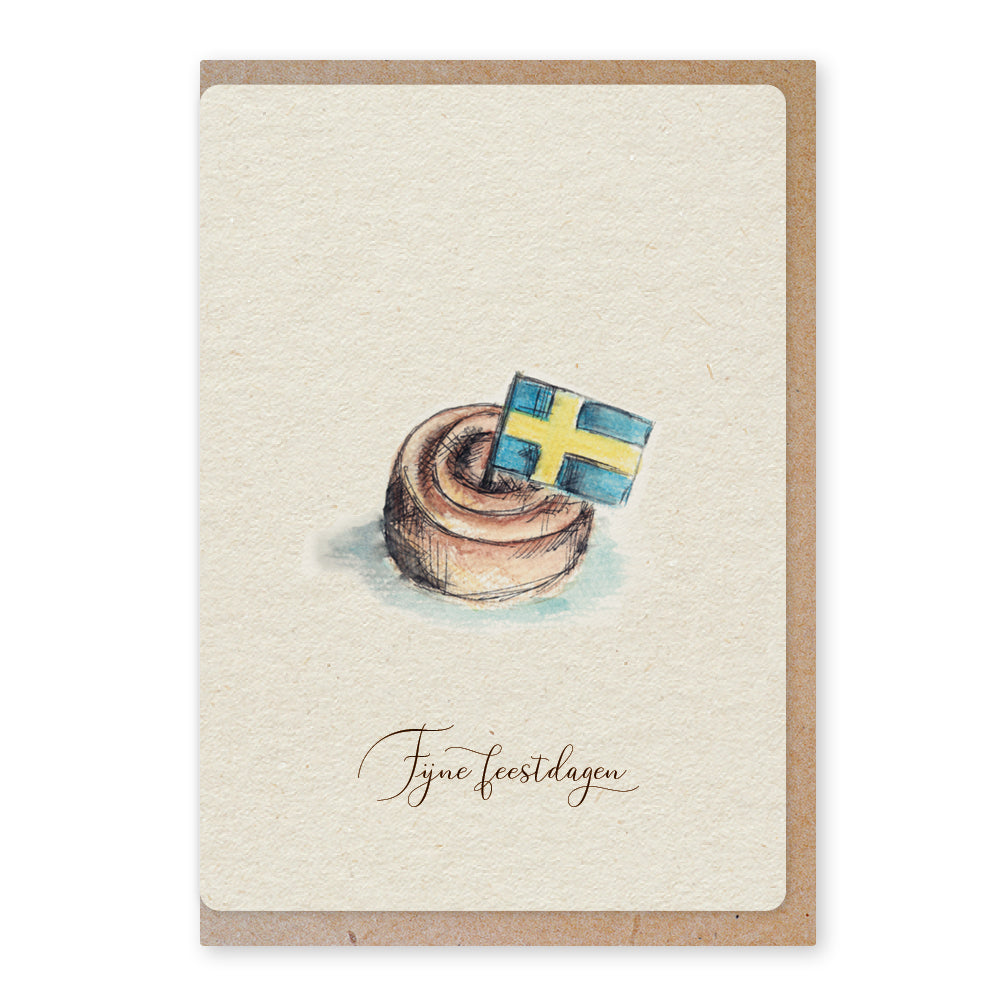 Een mooie duurzame enkele kaart met een tafereel van een Zweeds kaneelbroodje kanelbulle in aquarel voor een Kerstgroet of een Nieuwjaarswens. De illustraties zijn gemaakt in onze grafische studio. Gedrukt op Paperwise Naturel, boomvrij papier van landbouwrestafval. 
